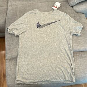Nike Men’s Large Grey with Blue Swoosh t-shirt. NWT